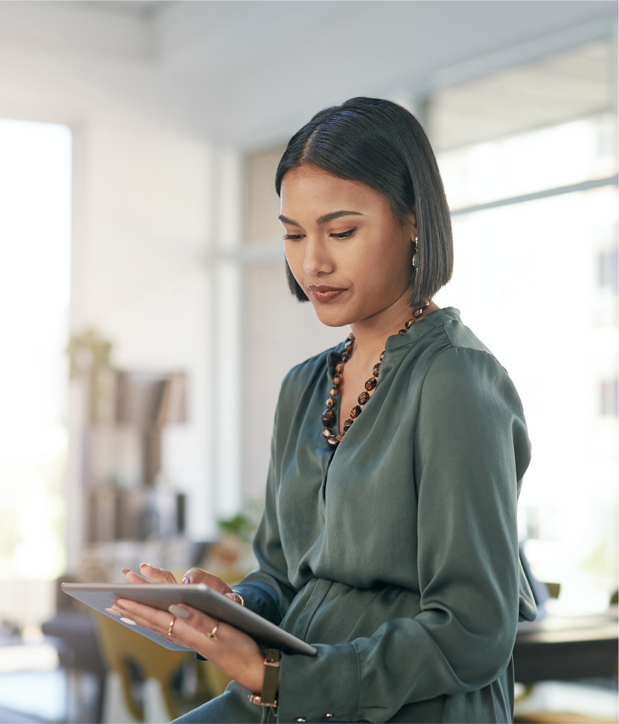 Businesswoman works on a tablet in her home office